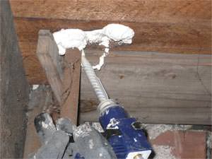 installing spray foam insulation on a rim joist in Stevensville